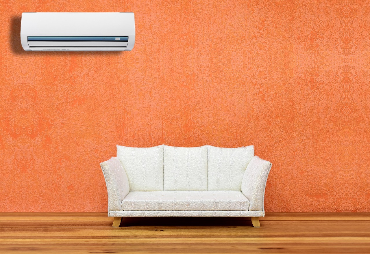 HVAC technician inspecting residential air conditioner