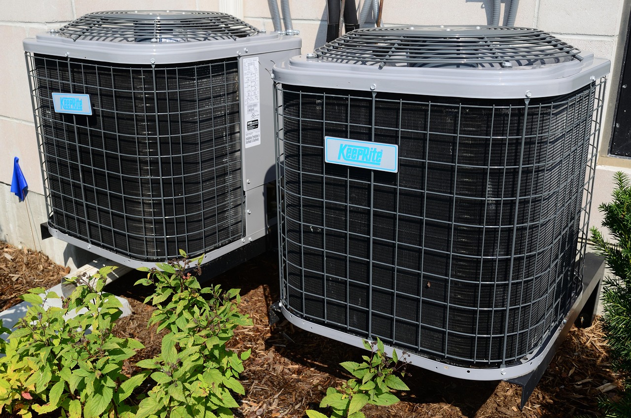 HVAC technician servicing central air unit
