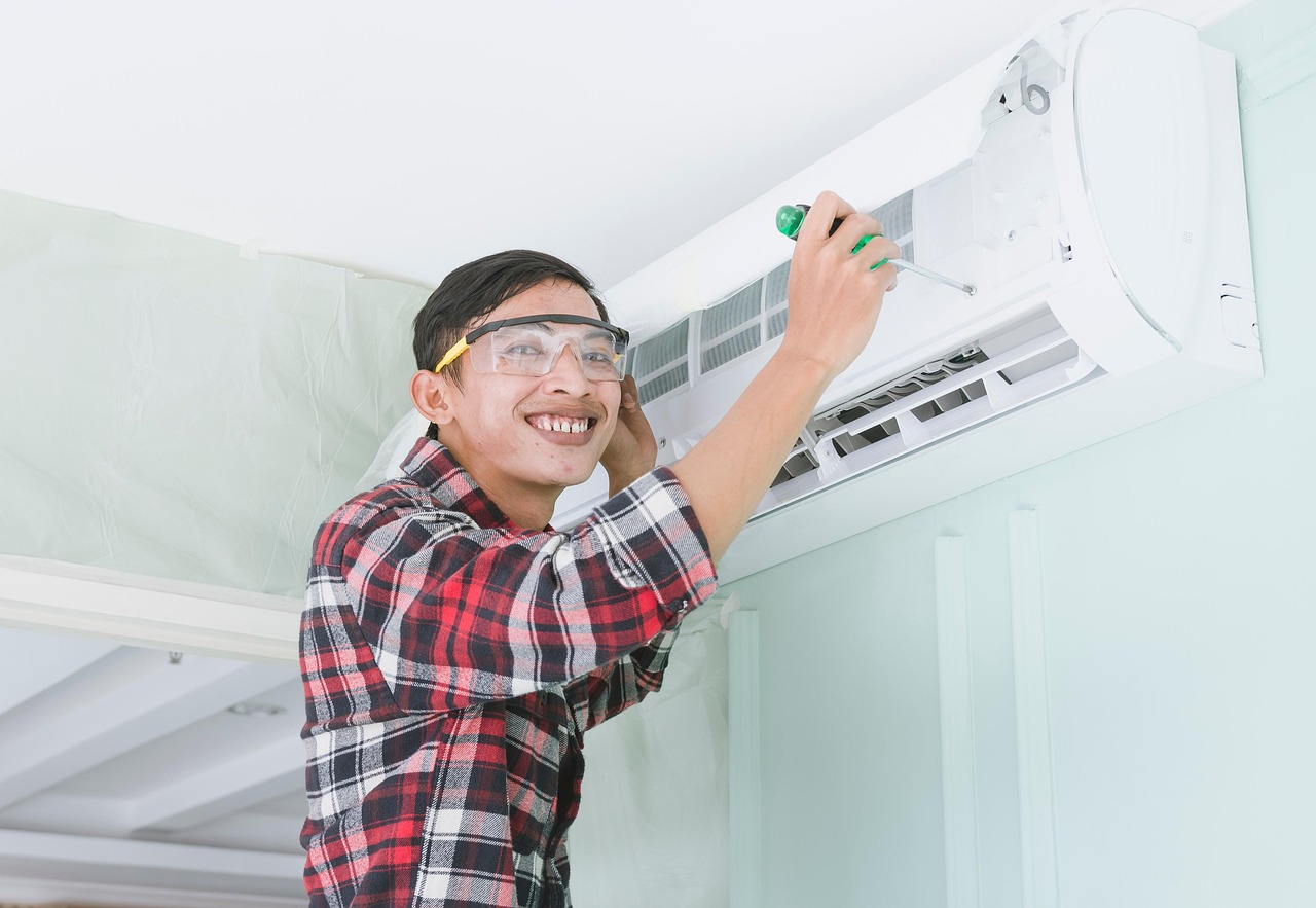 HVAC technician servicing residential air conditioner