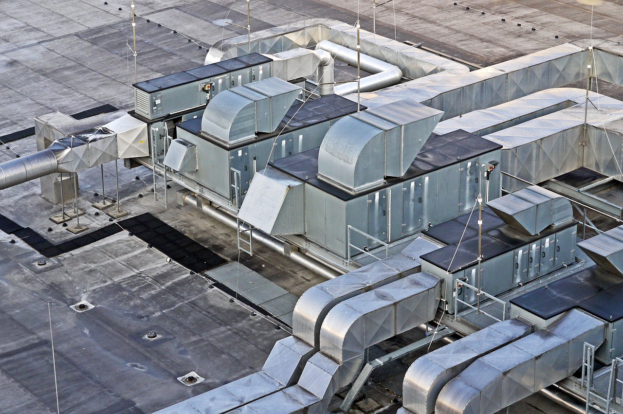 HVAC technician maintaining residential air conditioner