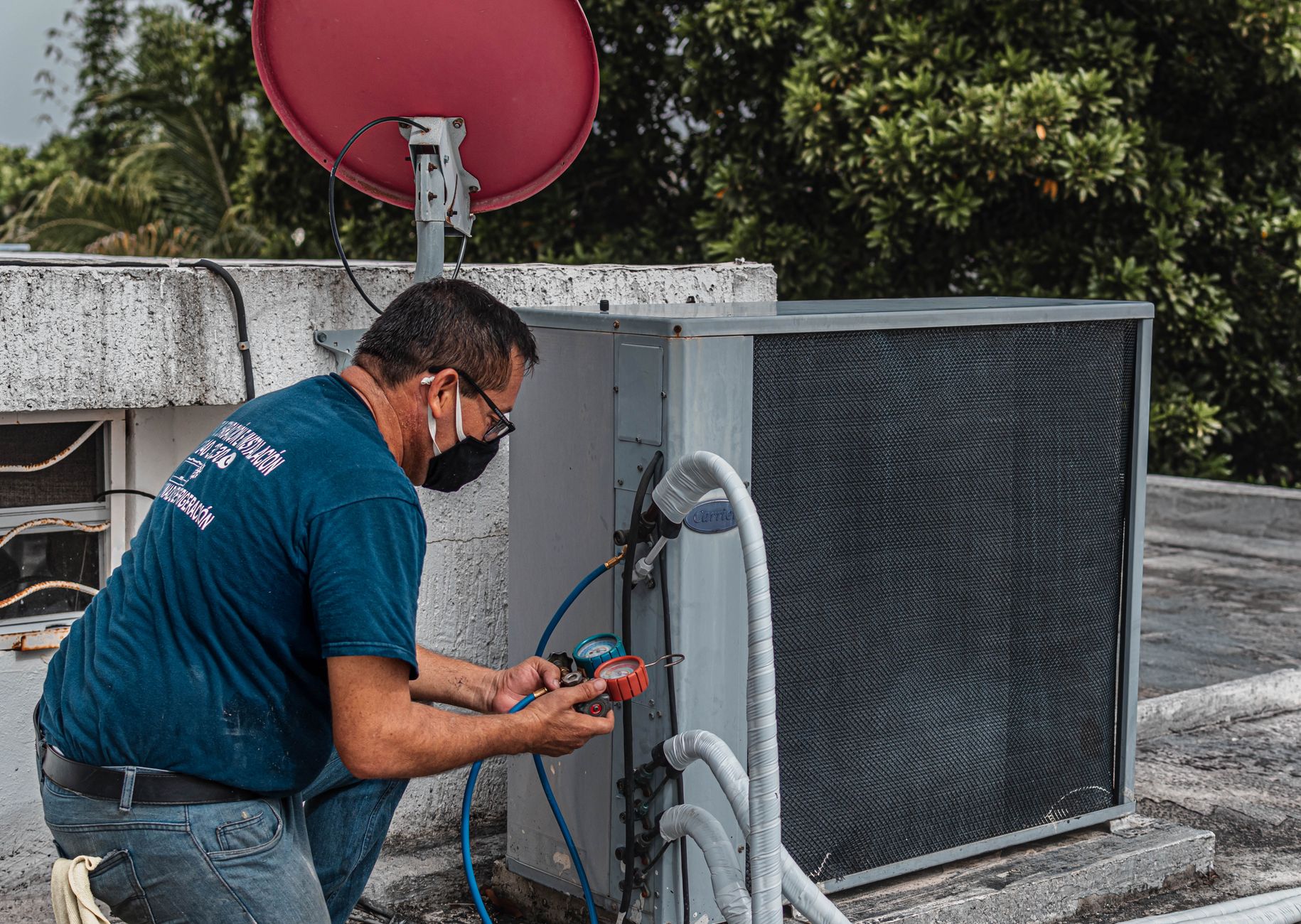 HVAC technician servicing home heat pump